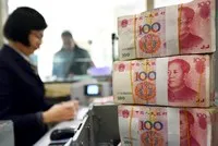 Đồng nhân dân tệ giao dịch tại Trung Quốc trong tuần này đã trượt giá mức thấp nhất trong 16 tháng so với đồng đô la Mỹ. Ảnh: AFP
