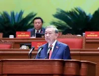 Tổng Bí thư Tô Lâm trình bày báo cáo về các văn kiện tại Đại hội XIV - Ảnh TTXVN .