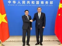 Bộ trưởng Bộ Công thương Lê Mạnh Hùng và Bộ trưởng Bộ Thương mại Trung Quốc Vương Văn Đào.