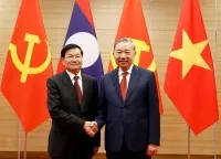 Tổng Bí thư Tô Lâm cùng Tổng Bí thư, Chủ tịch nước Lào Thongloun Sisoulith. Ảnh: Đức Thanh
